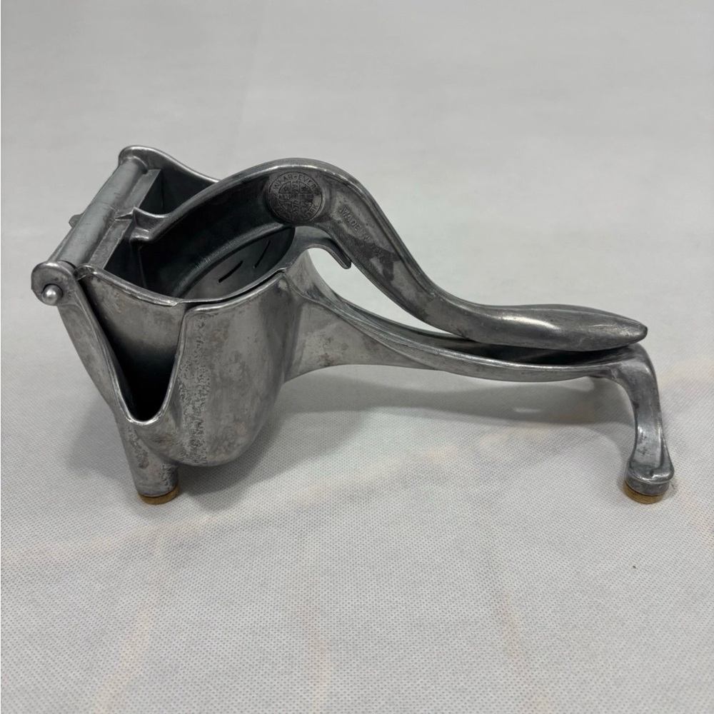 Sleek Silver Manual Citrus Press